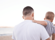 father holding child