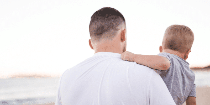 father holding child