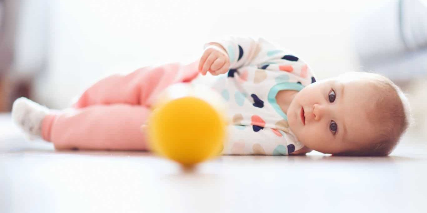 encourage baby to roll