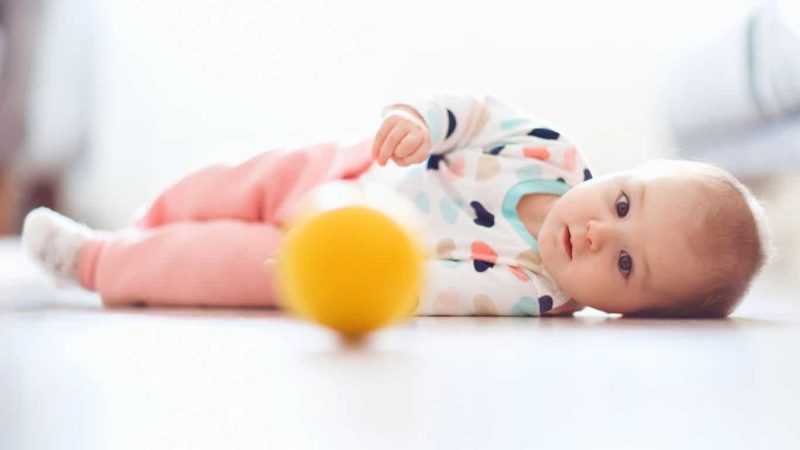 encourage baby to roll